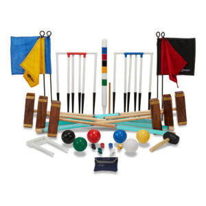 Complete croquet set laid out: mallets, balls, hoops, wickets, and colorful accessories for playing on the lawn.