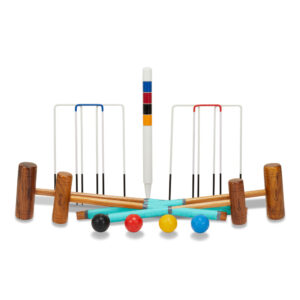 Croquet set laid out: mallets, wickets, and colorful balls on a white background, ready for play.