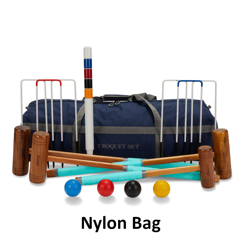 uber-games-family-croquet-set-4-player-2 - Masters Traditional Games Croquet set with wooden mallets, colored balls, and white hoops in front of a blue nylon bag labeled ‘CROQUET SET’.