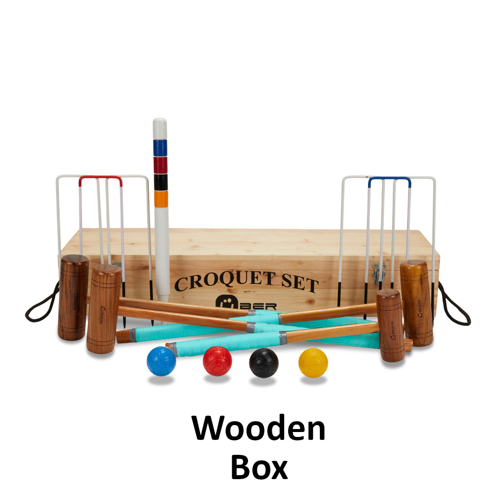 uber-games-family-croquet-set-4-player-3 - Masters Traditional Games Croquet set with wooden mallets, colored balls, and wickets arranged in front of a wooden storage box labeled Croquet Set.