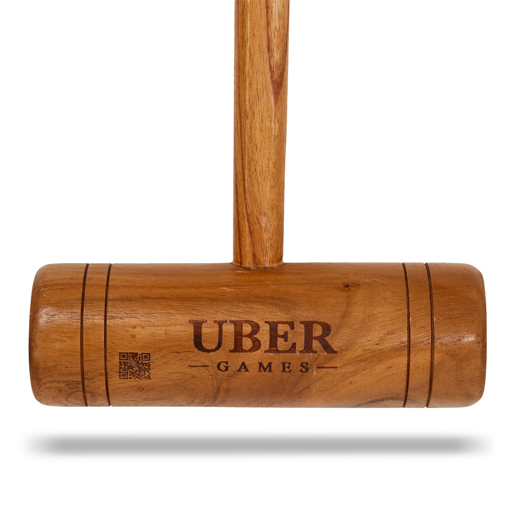 uber-games-family-croquet-set-6-player-7 - Masters Traditional Games Wooden gavel with the Uber Games logo stamped on the head, cast against a white background with a soft shadow.