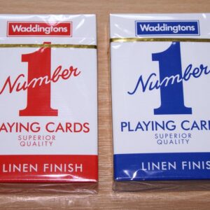 Two boxes of Waddingtons Number 1 playing cards with linen finish, red on the left and blue on the right, displayed on a wooden surface.
